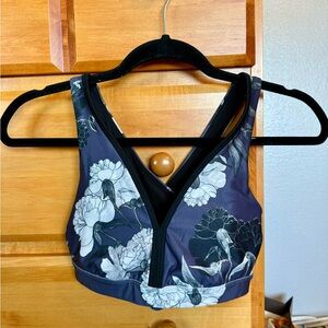 Purple and white floral sports bra